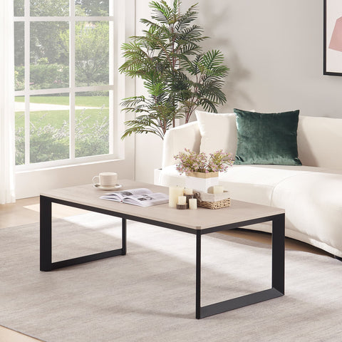 Modern rectangular coffee table with black steel base